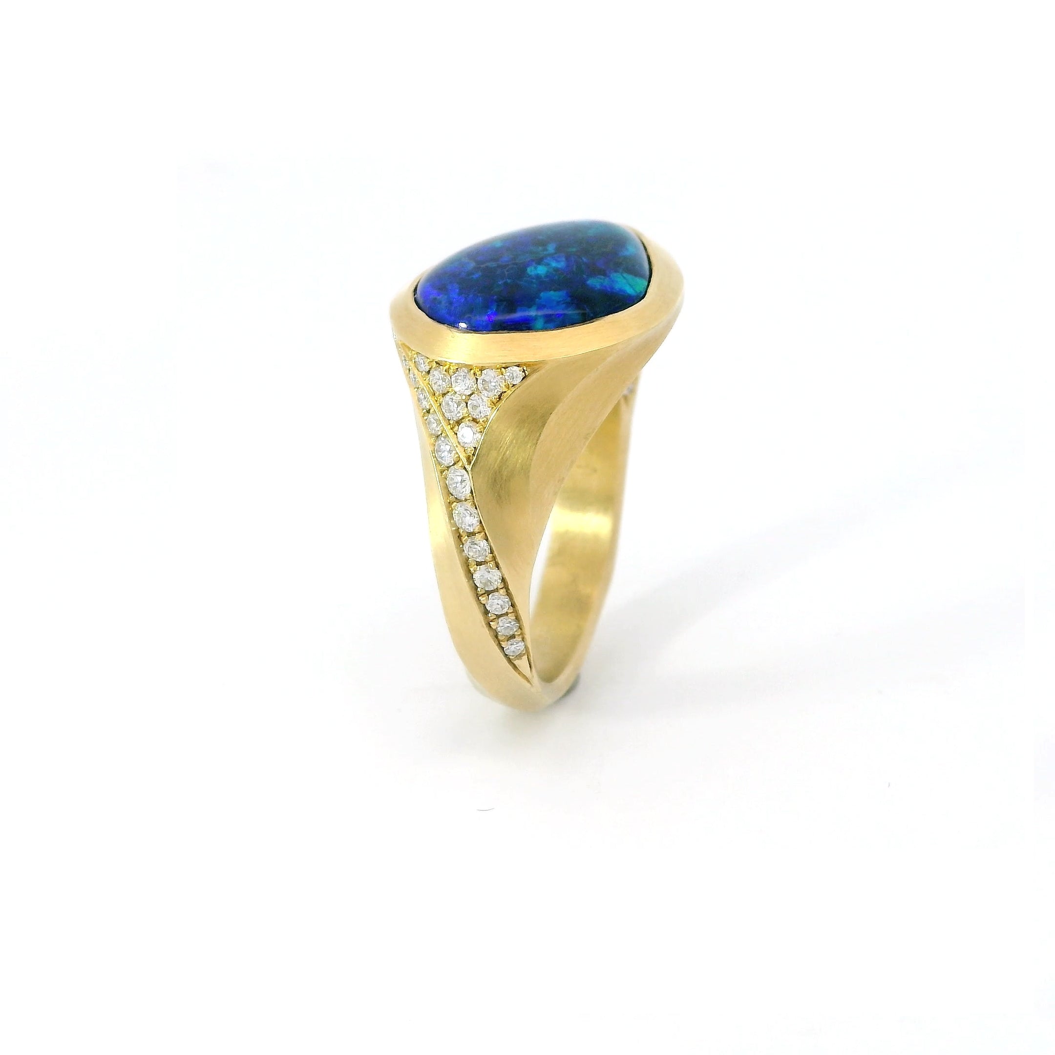 Lightning ridge opal and diamond Arris ring.