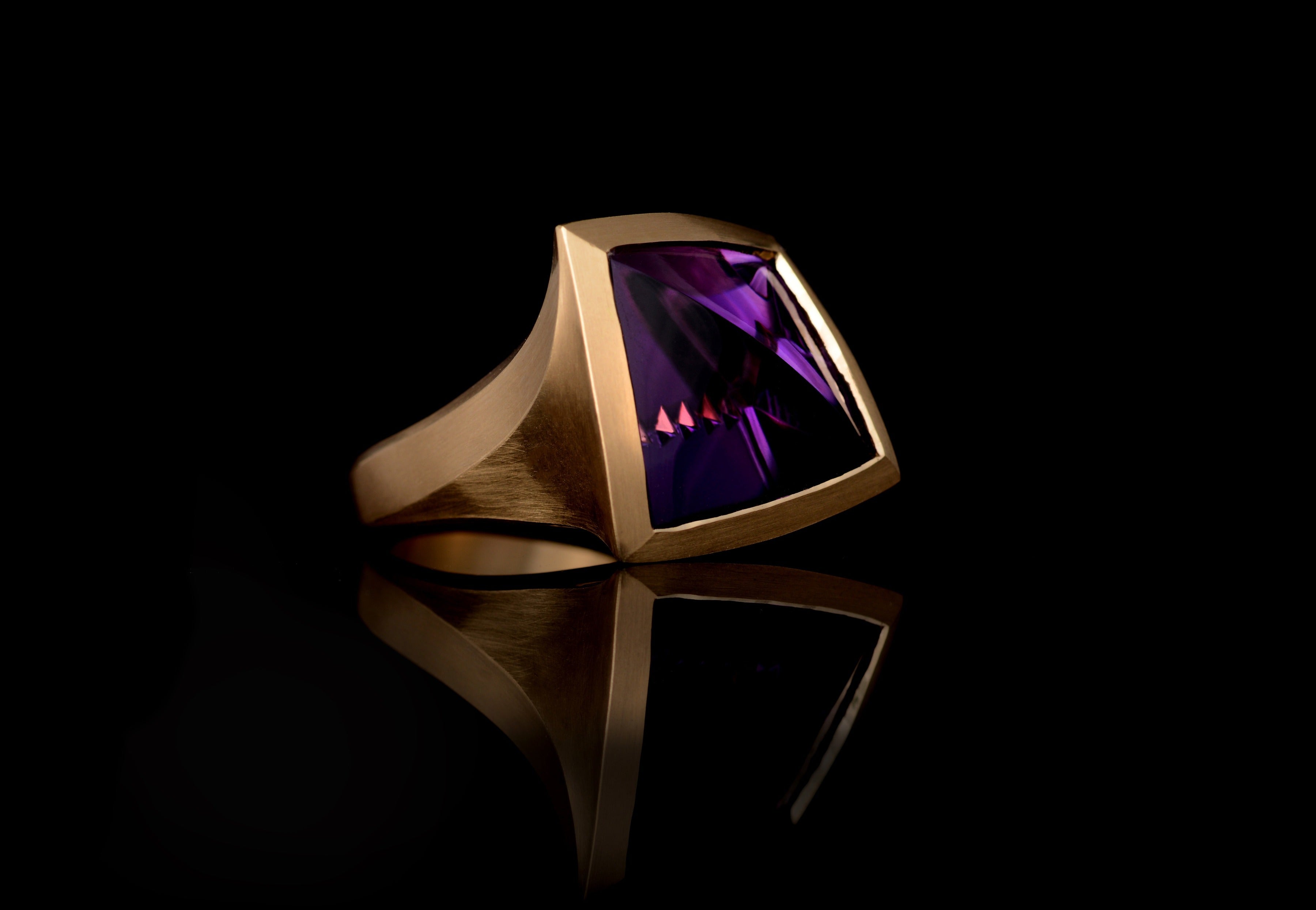 Arris: Fancy cut 16 carat amethyst set in yellow gold.-McCaul